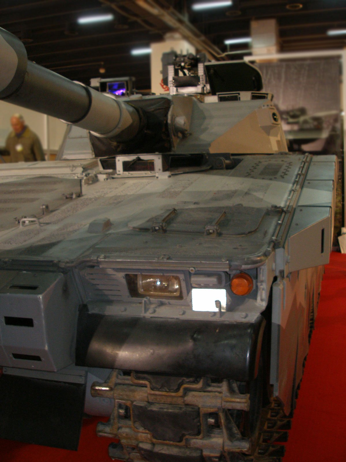 CV90120 frontal close-up at MSPO 2007. Front-quarter detail of the CV90120 at MSPO 2007, showing the CV90 glacis, turret front, main-gun installation, and roof sensors. 5 September 2007. MSPO 2007 / International Defence Industry Exhibition, Kielce, Poland (event context). Close exhibition view; not a combat-service photograph.