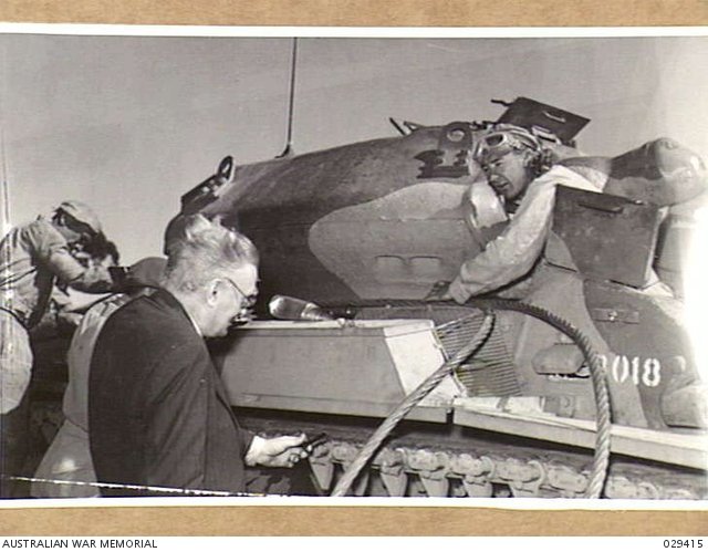 L. W. Brockington speaking with the driver of an all-Australian cruiser tank during trials, Puckapunyal, Victoria, 1 March 1943. Shows scale, crew access, and turret/hull presentation rather than variant-specific technical detail.