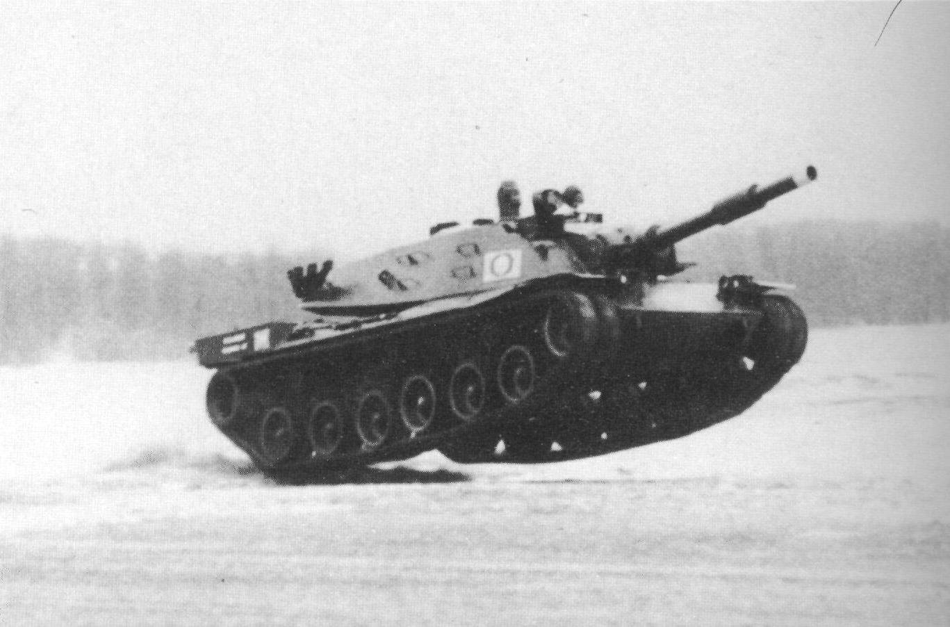 American MBT-70 prototype during Aberdeen Proving Ground speed tests. U.S. MBT-70 prototype. Date/. Aberdeen Proving Ground context; exact date not stated on the Commons file page. Shows the mobility/suspension discussion, but not a measured performance record by itself.