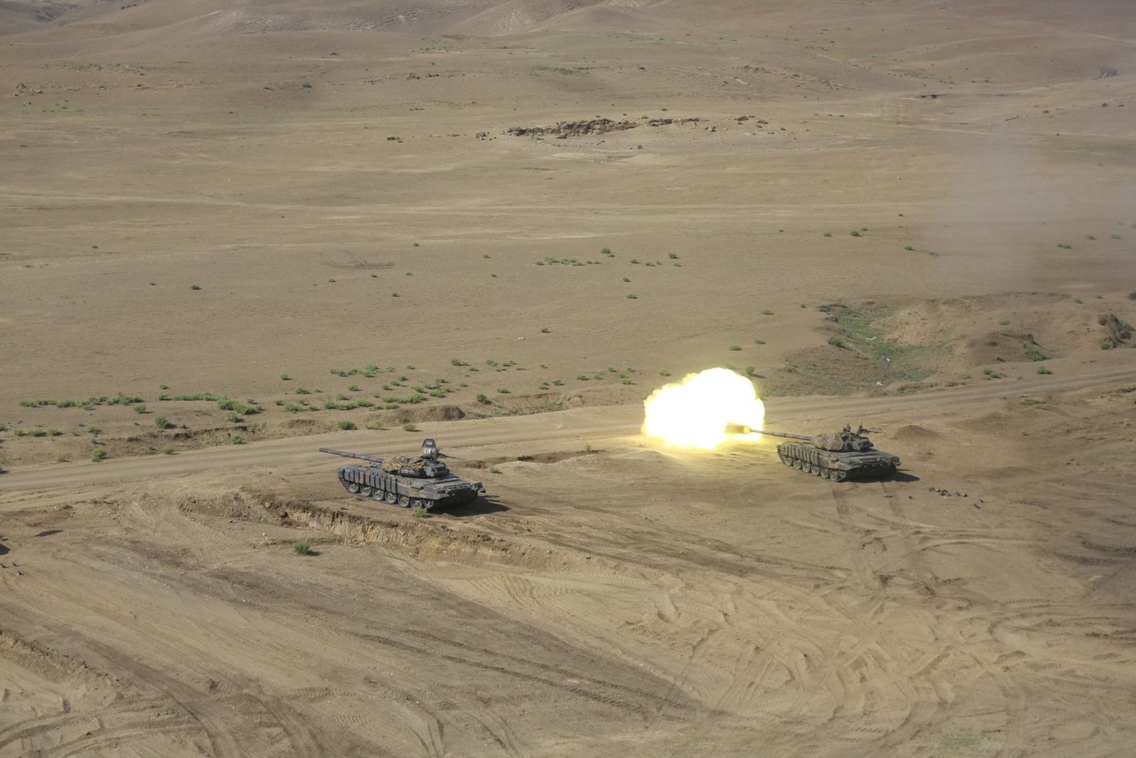 Georgian T-72 SIM-1 tanks firing during Noble Partner 17. Vehicle / variant identification: Georgian 44th Armored Battalion T-72 / T-72 SIM-1. 10 August 2017. Vaziani Training Area, Georgia. Useful service/training image, not a technical interior image.