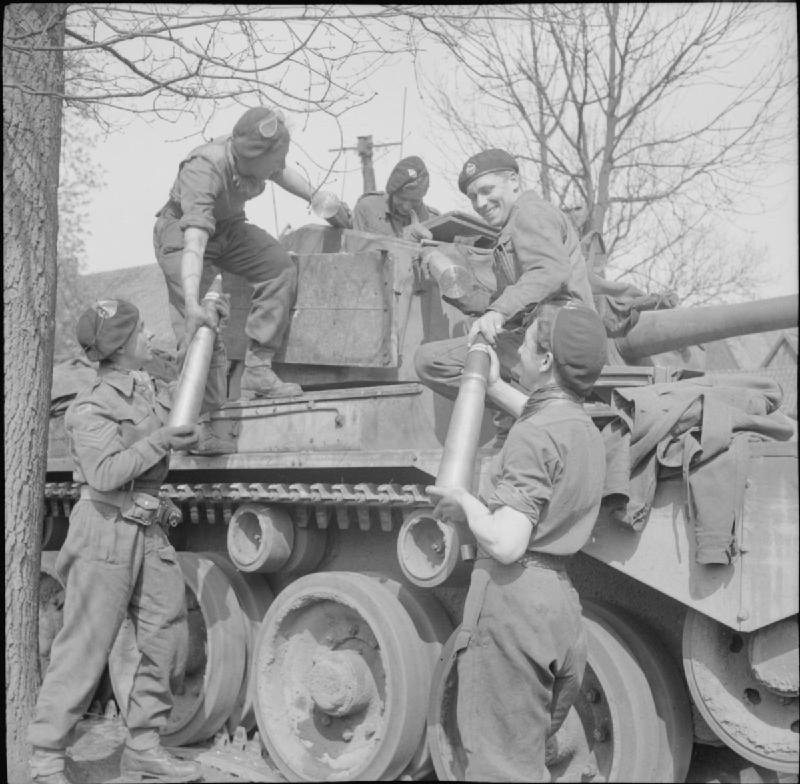 Crew of an 11th Armoured Division Comet loading 77 mm HV ammunition, Germany, 13 April 1945. useful view for ammunition size and crew handling, not an interior stowage diagram. [COMMONS-BU3617].