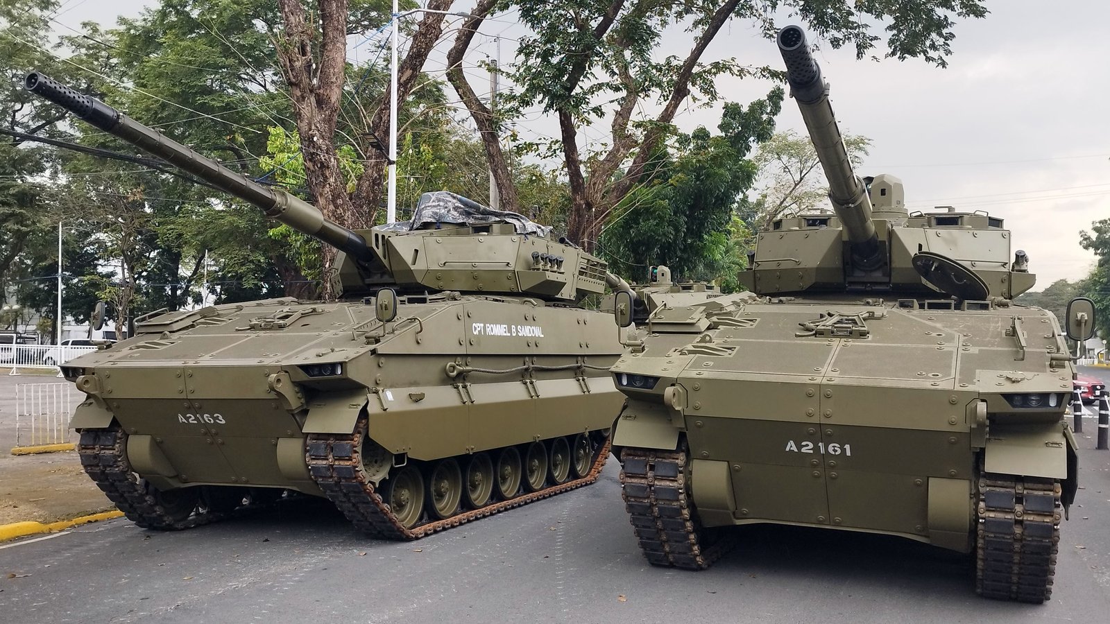 Two ASCOD II Sabrah light tanks on public display. 21 December 2023, 13:05 local camera time. coordinates on file page 14.611767, 121.062442. variant comparison view showing two gun tanks.