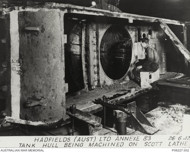 Australian Cruiser tank hull being machined on a Scott lathe at Hadfields Australia Ltd, 26 June 1942. New South Wales, Australia. AWM caption identifies one-piece cast hulls from Bradford Kendall transferred to Hadfields for machining.