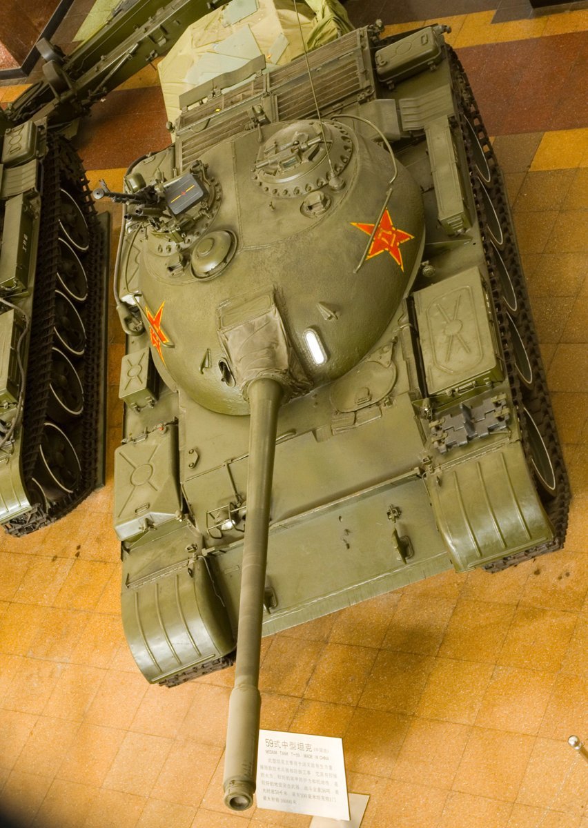 Type 59 / WZ-120, overhead view showing turret roof, hatches, engine deck, external tanks, and five-road-wheel layout. Vehicle / variant identification: basic Type 59 museum vehicle. August 2007; EXIF timestamp on file page records 10 August 2007. Beijing Military Museum, China. museum-preserved vehicle; Shows layout rather than operational configuration.